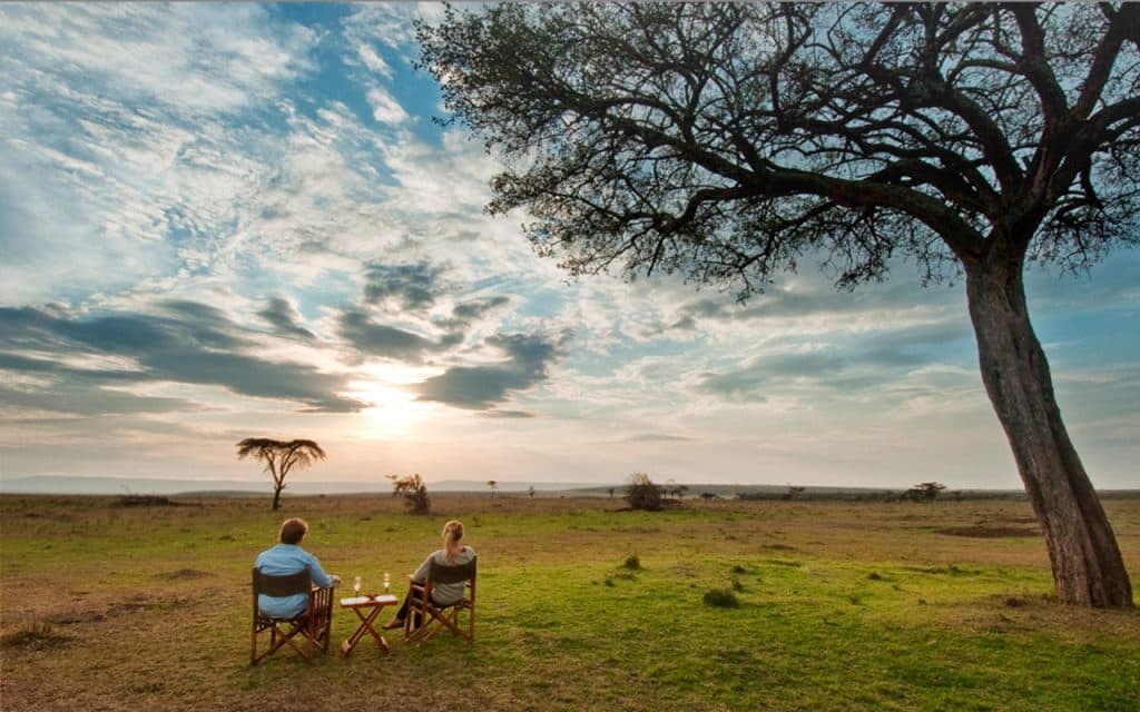 A Maasai guide looking over the savanna
